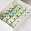 mini vanilla cupcakes with blue frosting and leafs