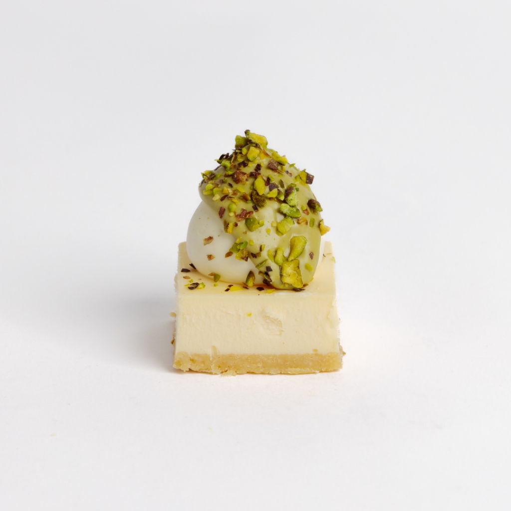 Mini Pistachio Cheesecake with Pistachio Spread Glazed on top and pistachio nuts