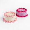 Two Mini Hearts Buttercream Cakes, one cream with pink hearts and one purple with pink hearts
