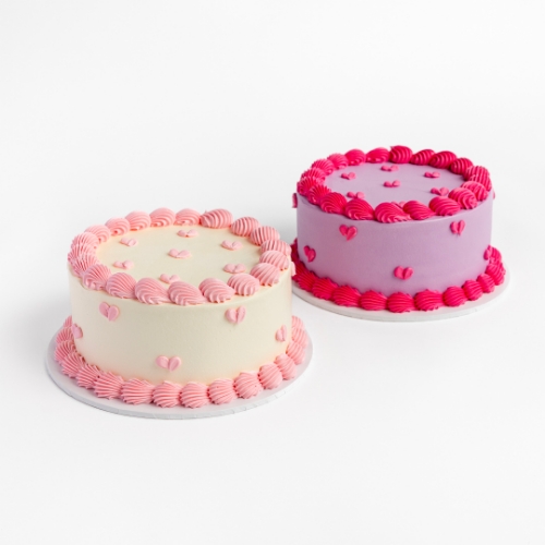 Two Mini Hearts Buttercream Cakes, one cream with pink hearts and one purple with pink hearts