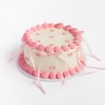 Mini Hearts Buttercream Cake with cream frosting and pink heart decorations