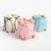 Three Buttercream Bow Cakes in white with black bows, pink with pink bows, and blue with blue bows, featuring cascading ribbons and roses on top
