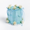 Blue buttercream cake with blue ribbon bows and roses