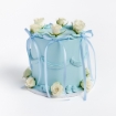 Blue buttercream cake with blue ribbon bows and roses