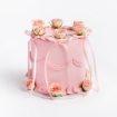 Pink buttercream cake with pink ribbon bows and pink roses