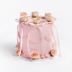 Pink buttercream cake with pink ribbon bows and pink roses