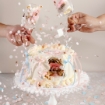 Customisable Gender Reveal Cake from LaManna with blue or pink option glasses full with cake