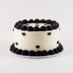 Mini Hearts Buttercream Cake with creamy white frosting and black heart decorations