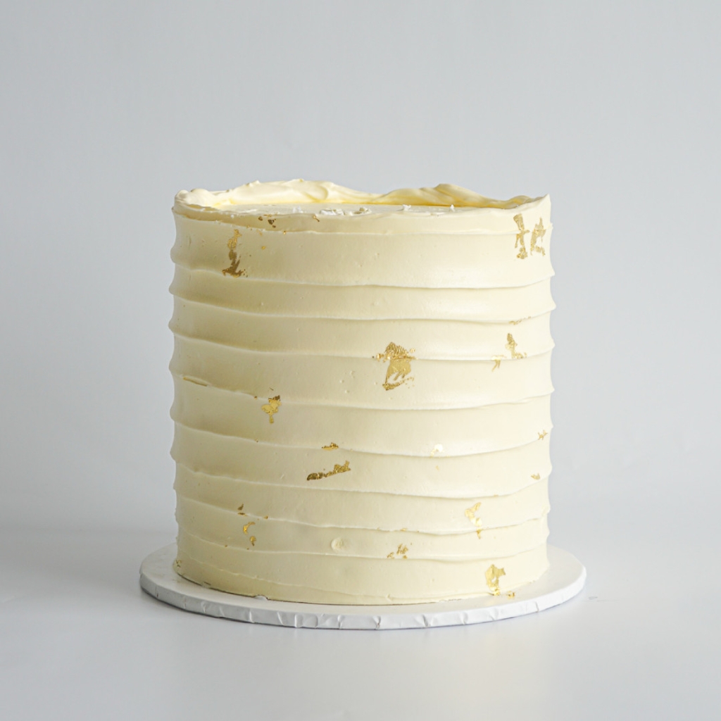 LaManna Creamy White Rough Lines Buttercream Cake with Gold Leaf